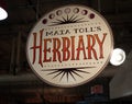 The hanging sign for Maia TollÃ¢â¬â¢s Herbiary in the historic Reading Terminal Market, an